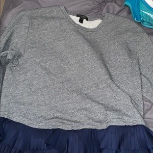 Long sleeve shirt with navy material along bottom